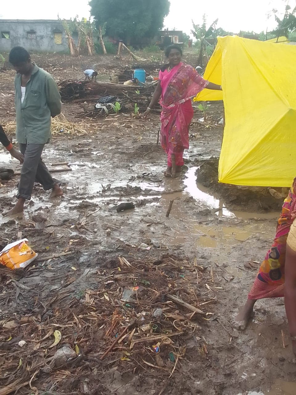 Relief work through mud and water after floods