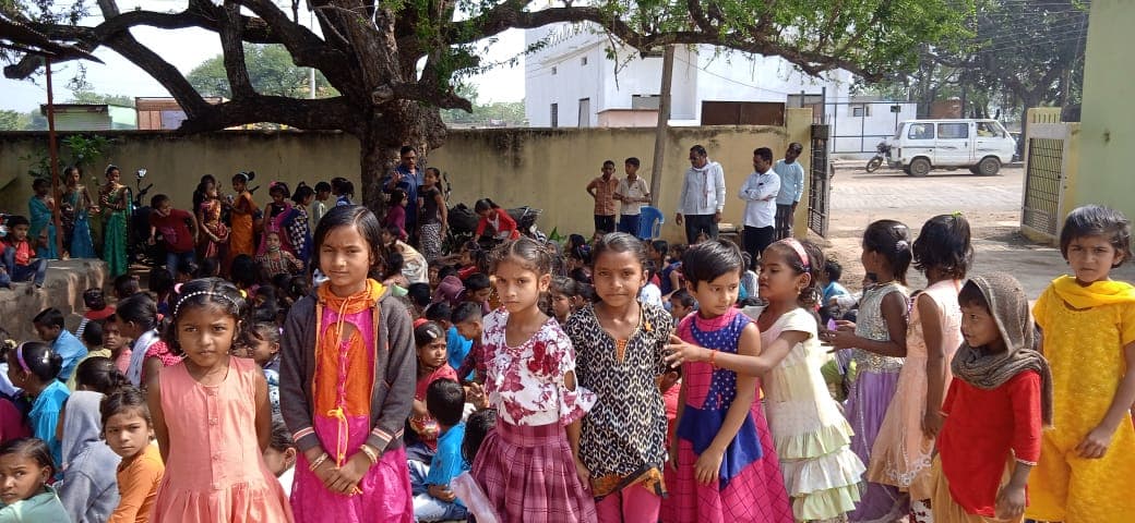Children gathered in a school courtyard